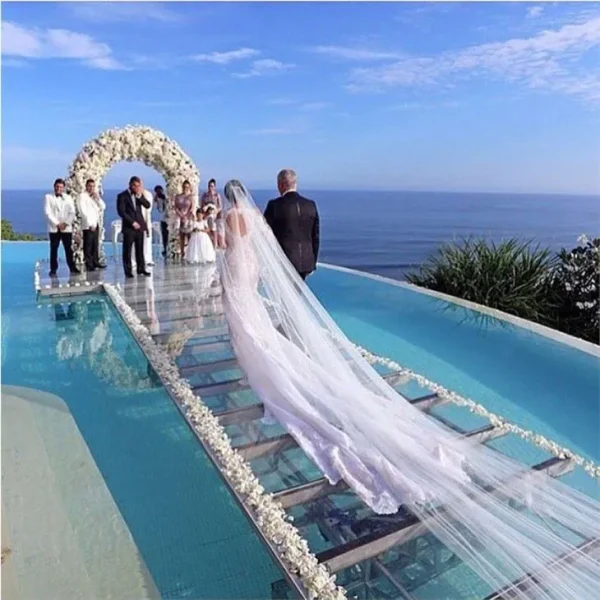 Finished transparent acrylic wedding stage at pool and sea side venue