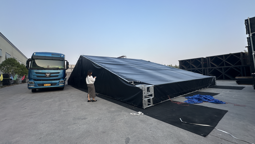 Large outdoor black aluminum tent under construction & erection site