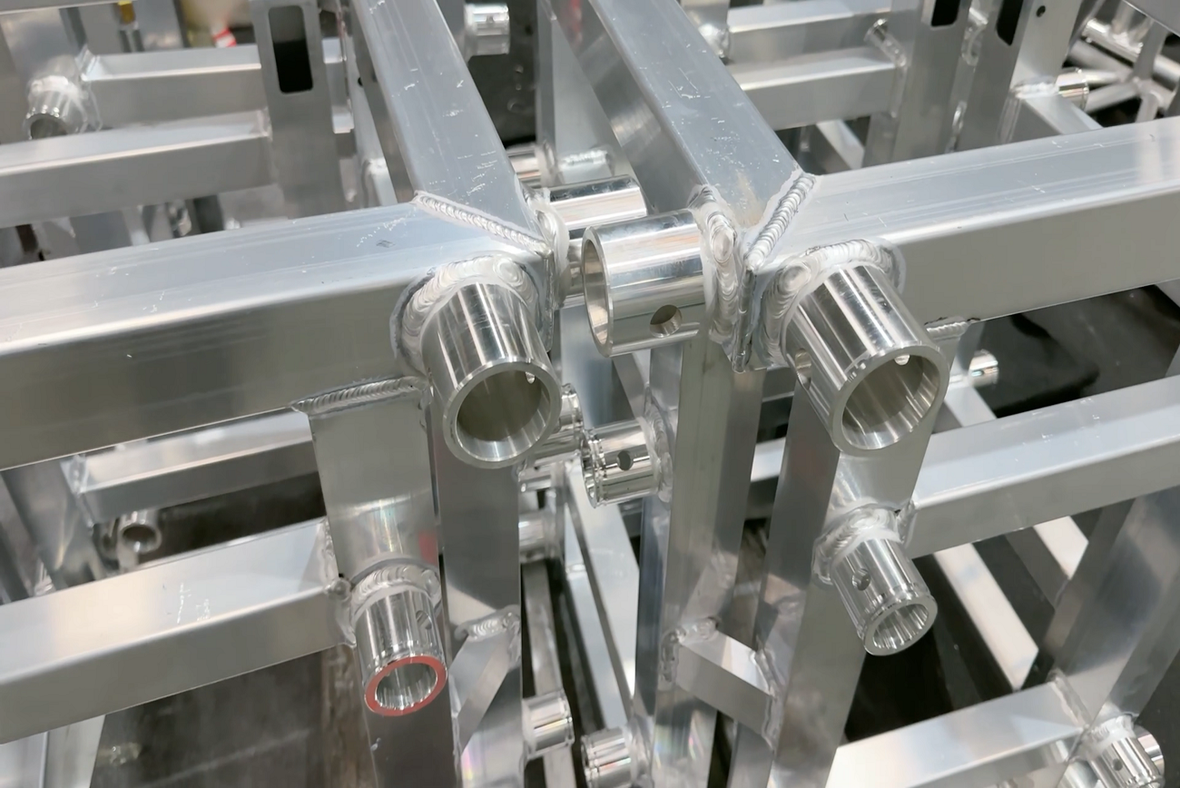 Close-up of aluminum stage truss welding joints and structural connections
