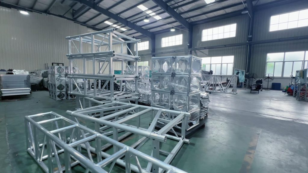 Heavy-duty aluminum spigot truss system with pin connection used for stage construction and event structures