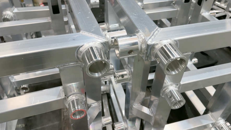 Close-up of aluminum stage truss welding joints and structural connections