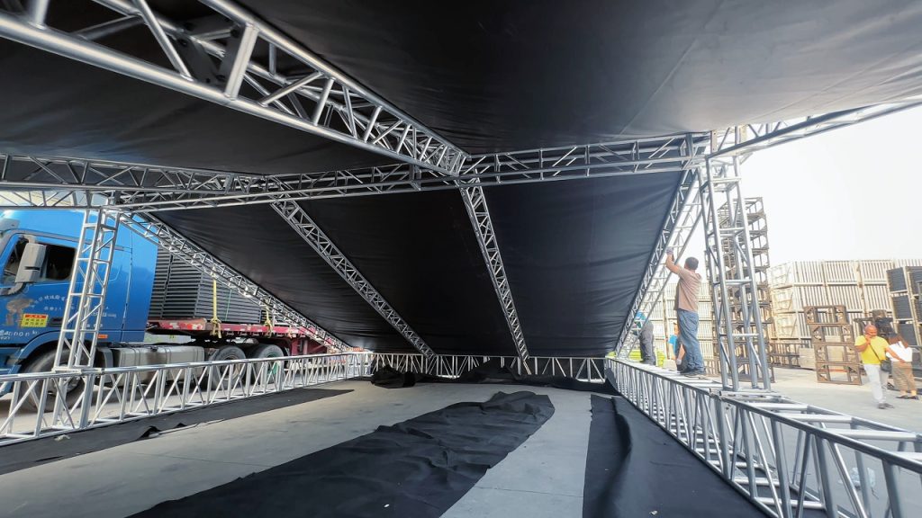 Interior view of PVC roof fabric installed on aluminum roof truss system showing tight and even tension