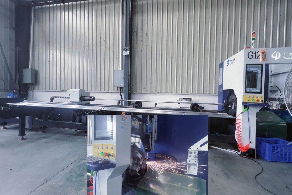 Laser cutting machine precisely cutting aluminum tubes for stage truss and event structure manufacturing in factory production line