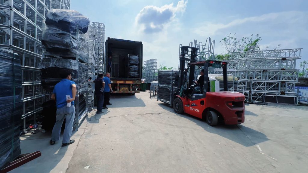Protective isolation board used between heavy steel Layher scaffolding and aluminum stage platforms during container loading