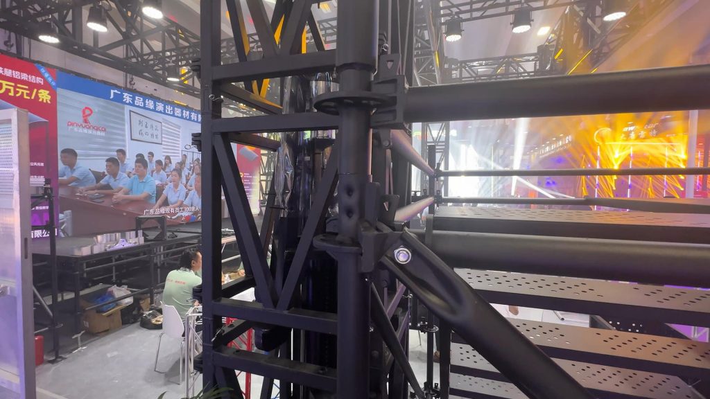 Ringlock scaffolding stage structure showing black powder-coated finish for enhanced corrosion resistance at VAC Music Festival