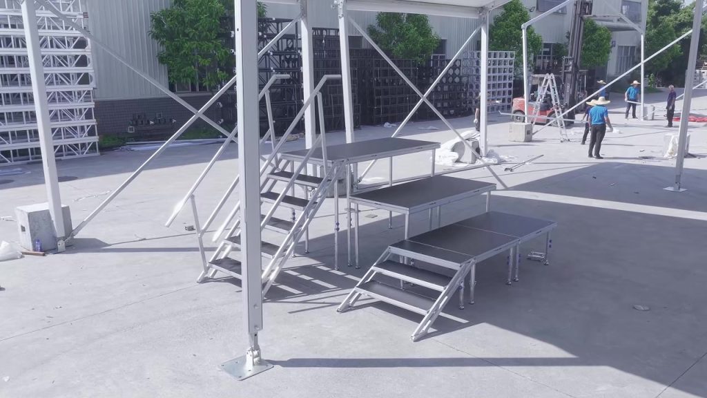 Portable outdoor stage installation with modular stairs