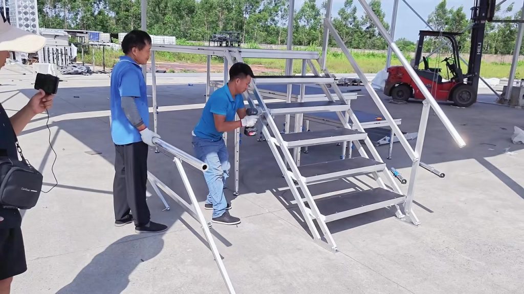 Installing portable outdoor stage stairs and guardrails