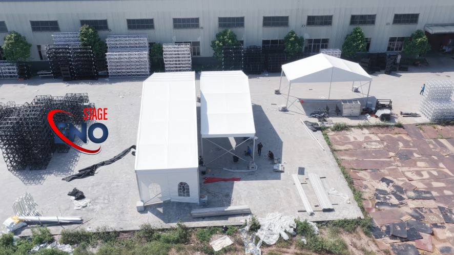 Outdoor event tent installation and factory test assembly by ENO Stage team before delivery
